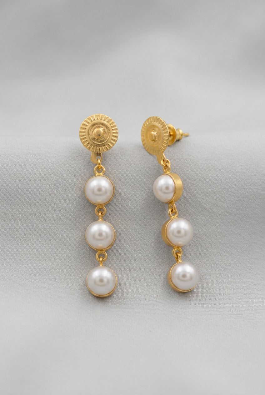 A pair of gold-plated dangle earrings with three white faux pearls, for women