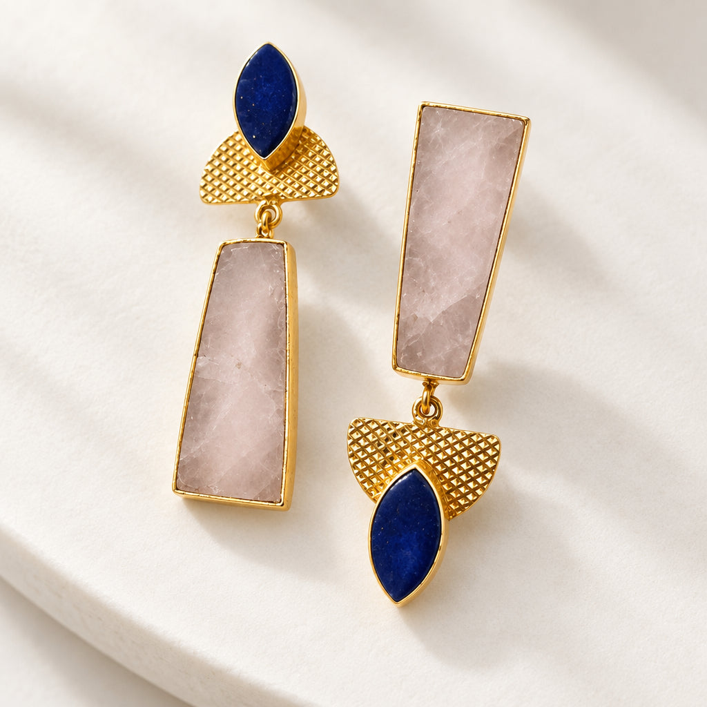 A pair of gold-tone drop brass earrings with rectangular gray natural stone and dark blue teardrop-shaped stones.