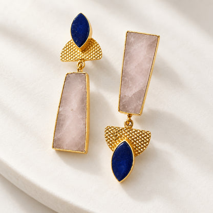 A pair of gold-tone drop brass earrings with rectangular gray natural stone and dark blue teardrop-shaped stones.