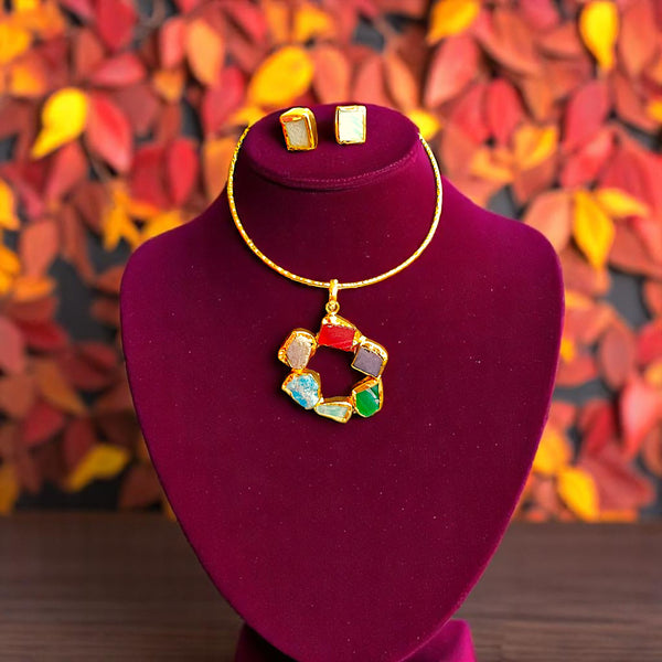 Gold-tone multi-stone hasli necklace and stud earring set with circular geometric pendant featuring red, green, 